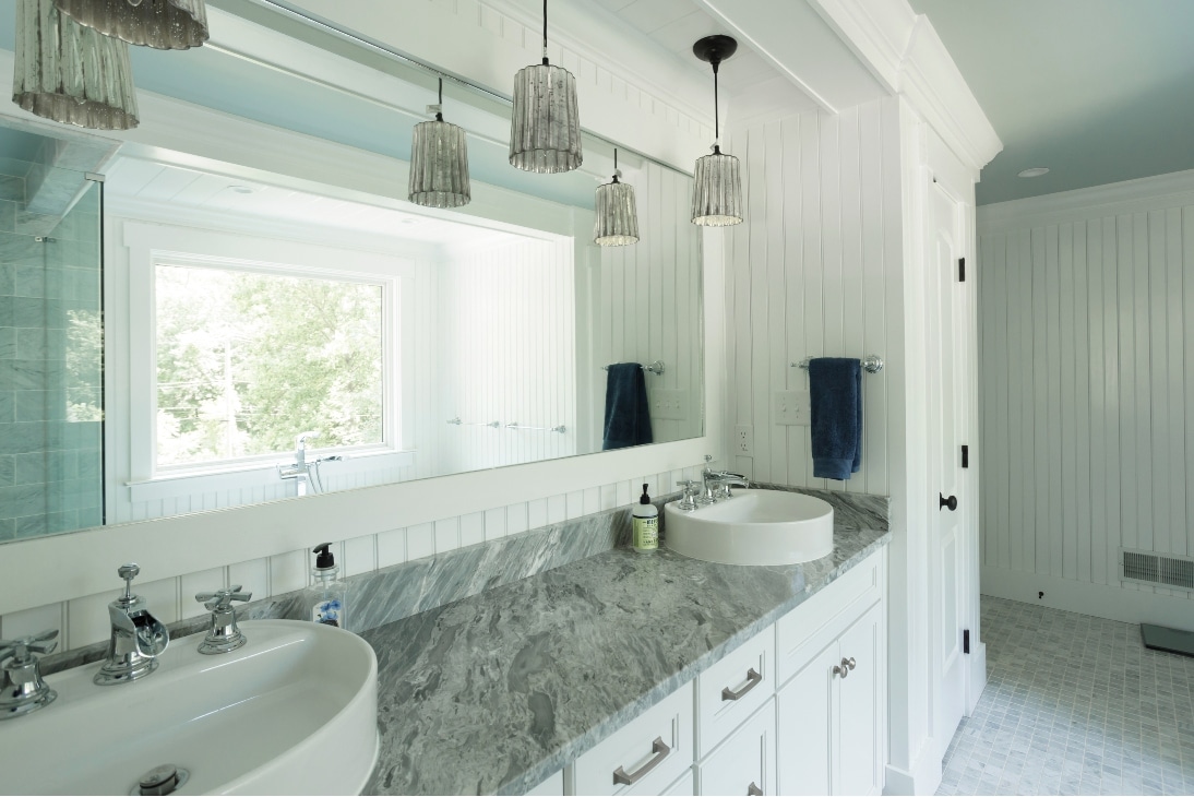 A Custom Bathroom Remodel With A Wide Mirror, New Lights, And Two Sinks In Blue Bell Pa