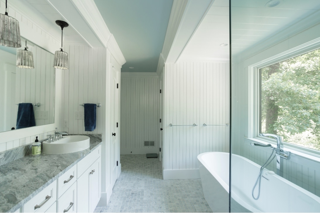 A Custom Bathroom Remodel With A Wide Mirror, New Lights, And Two Sinks In Exton Pa