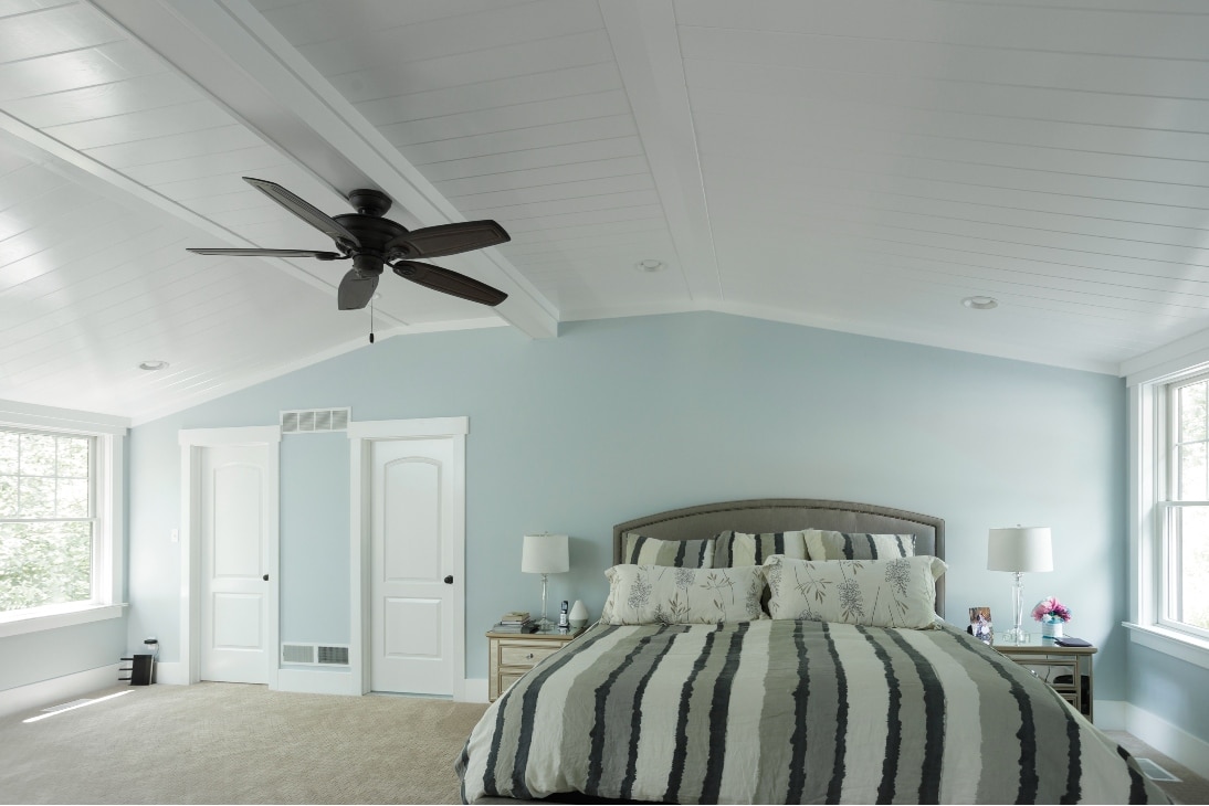 A Remodeled And Refinished Bedroom With A Light-Blue Theme, And A Ceiling Fan In Elizabethtown Pa