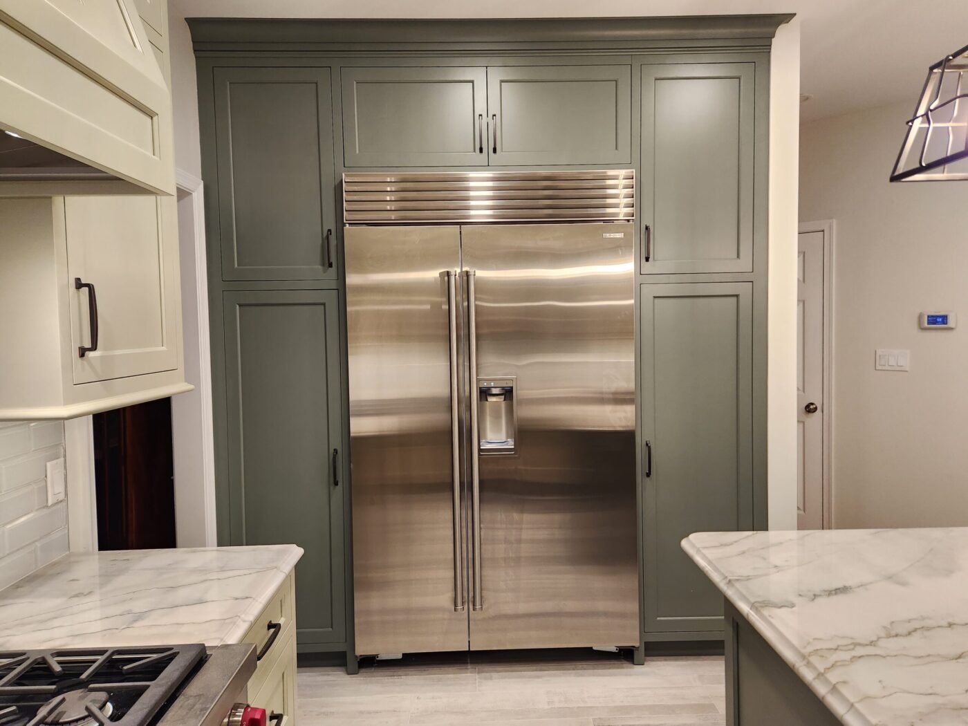 A Remodeled Kitchen With A Fridge Embedded Into The Wall With Cabinets In Chester County Pa