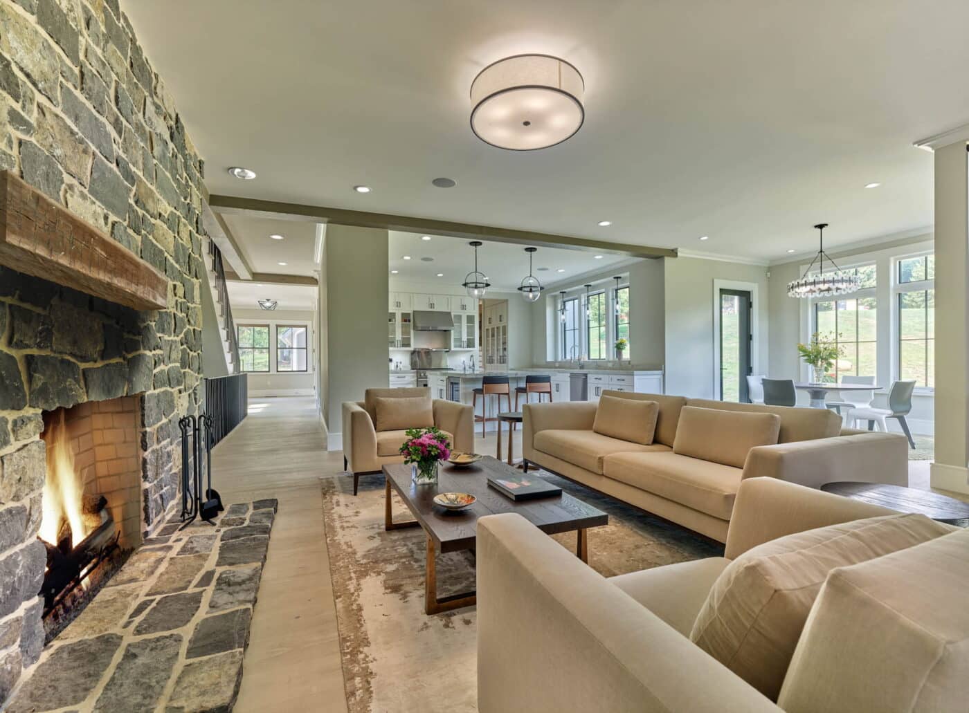 A Wide, Spacious Living Room With Three Couches, And A Stone Brick Fireplace In Lancaster County, Pa