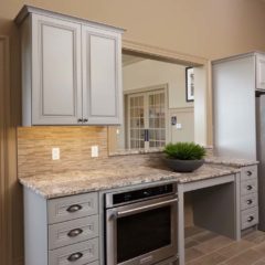 A Kitchen With Beige Cabinets, As Well As A Granite Countertop Done By Remodeling Contractors From Foggy Ridge Interiors