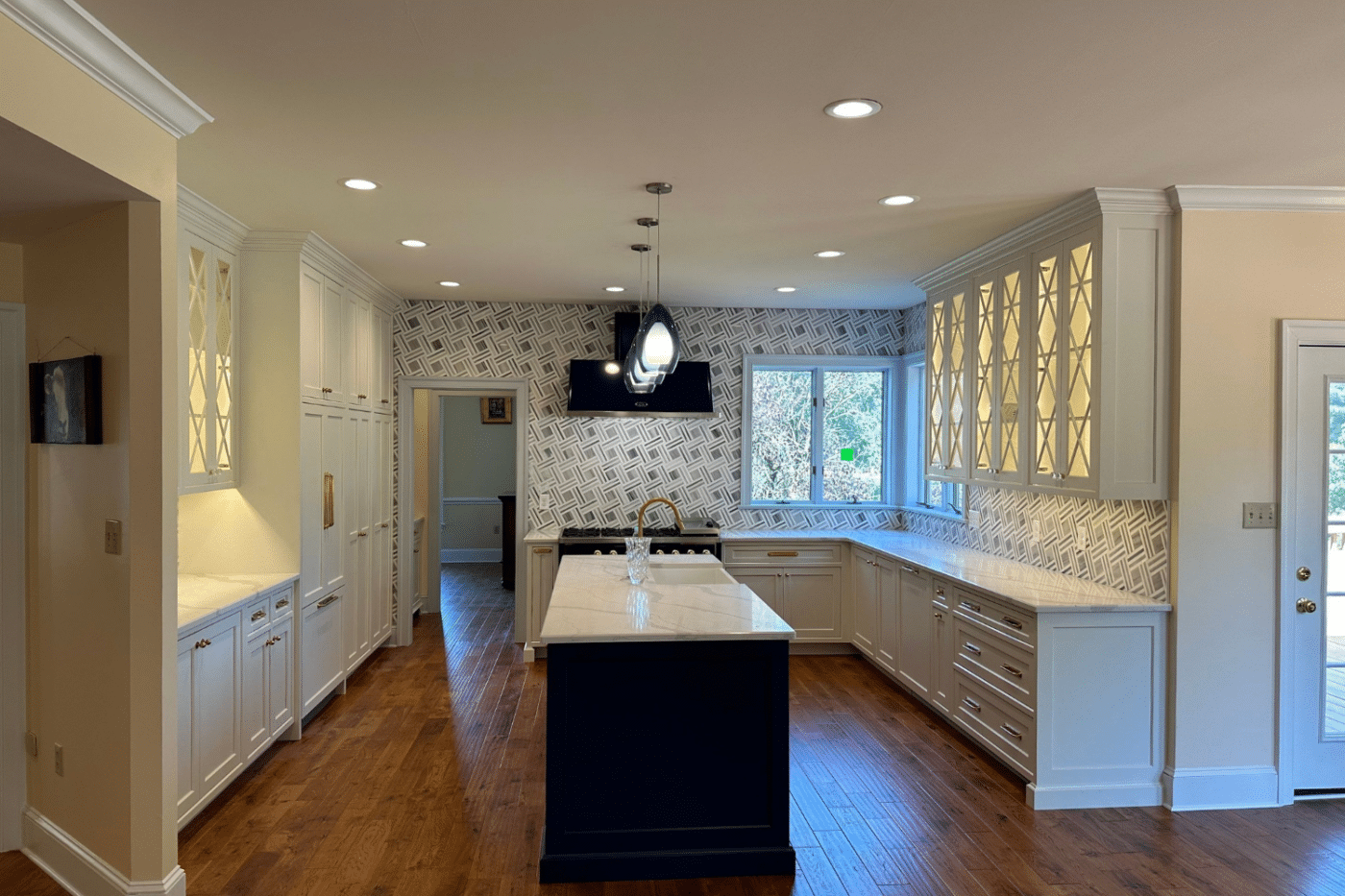 Kitchen Remodeling With White Cabinets, Island And Hanging Lights In Lansdowne Pa